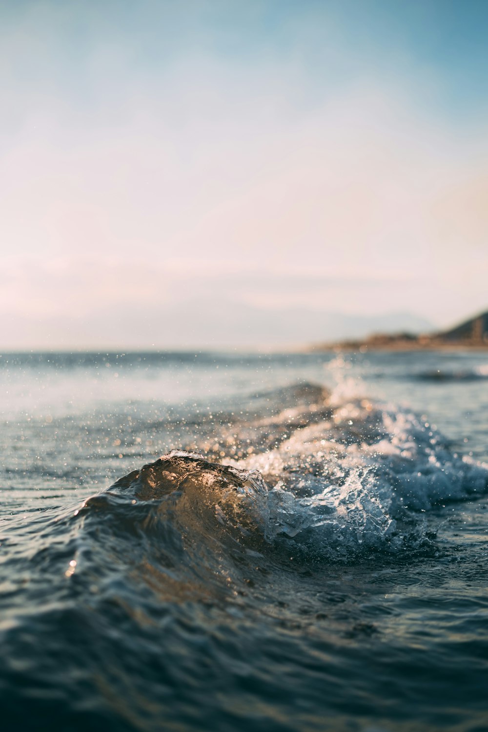 Ocean waves along a sunny coastline